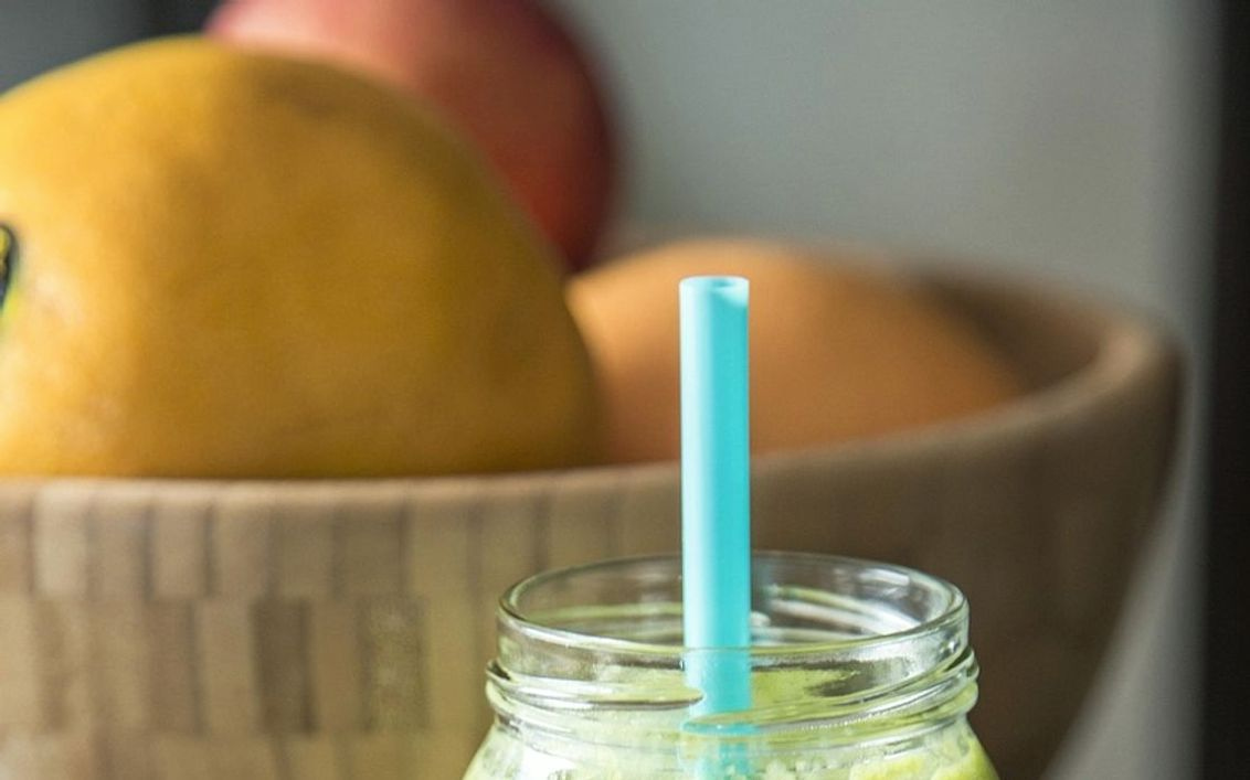 A chilled berry smoothie in a tall glass